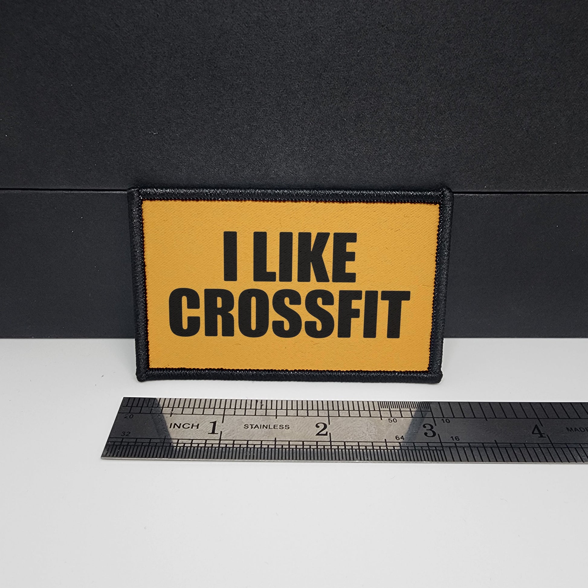 Yellow patch with 'I LIKE CROSSFIT' text on a black background, next to a ruler for scale.

CAPS LOCK ORIGINAL - morale patch - 2x3 inch – hook and loop - iron-on - interchangeable patch - hat - bag - sports