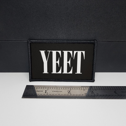 Black patch with 'YEET' text on a white surface with a ruler for scale.

CAPS LOCK ORIGINAL - morale patch - 2x3 inch – hook and loop - iron-on - interchangeable patch - hat - bag
