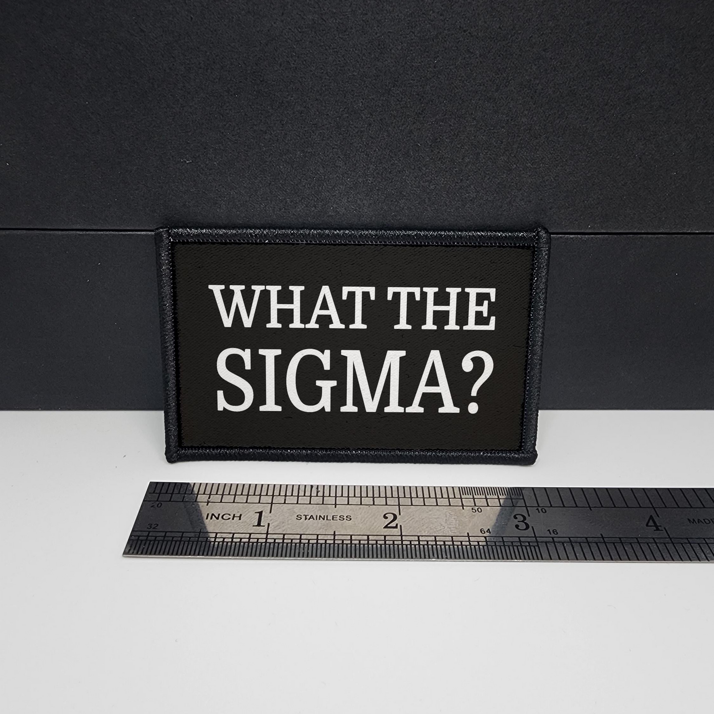 Black patch with 'WHAT THE SIGMA?' text on a white surface with a ruler for scale.

CAPS LOCK ORIGINAL - morale patch - 2x3 inch – hook and loop - iron-on - interchangeable patch - hat - bag
